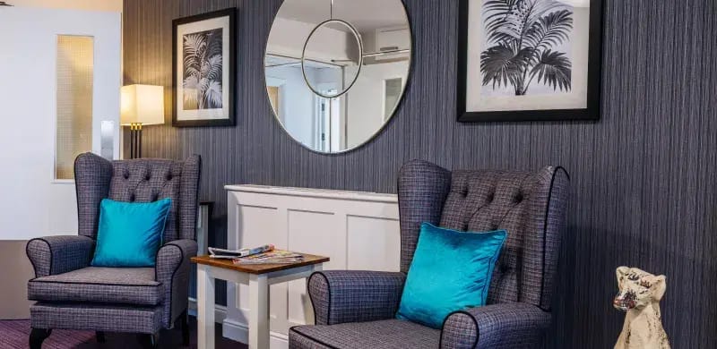 Cozy lounge area with armchairs and decorative art