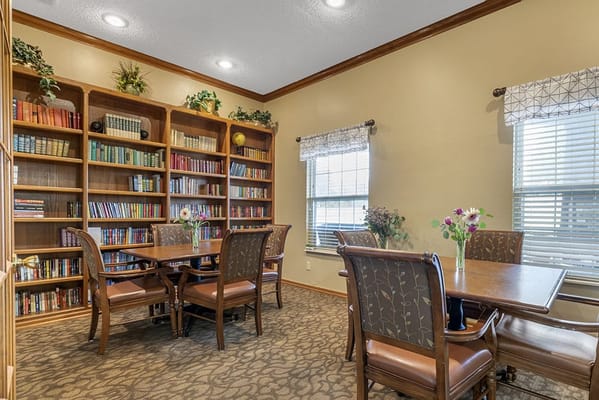 Cozy common area with bookshelves and seating