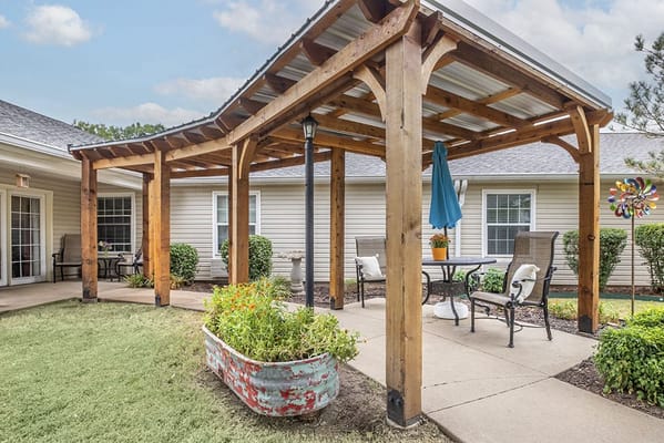 Covered outdoor seating area with a garden