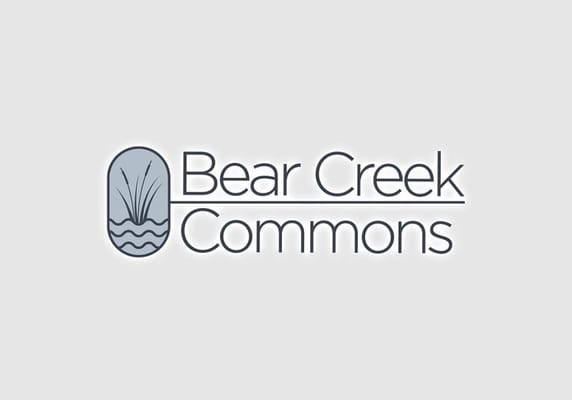 Bear Creek Commons facility logo with decorative elements