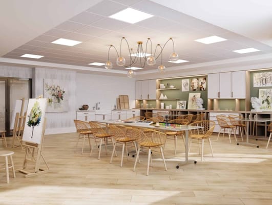 Bright activity room with art supplies and seating