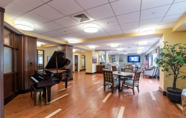 Bright common area with a piano and seating