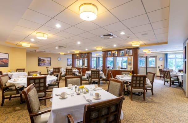 Bright dining room with tables set for meals