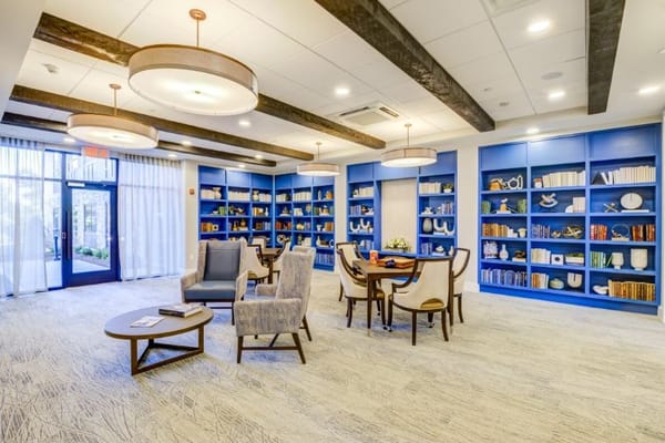 Bright common area with bookshelves and seating