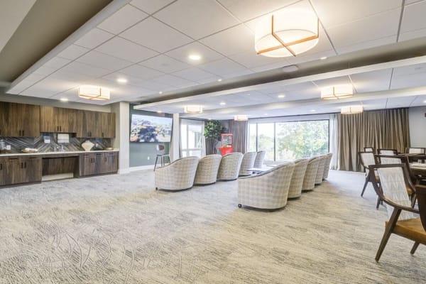 Bright common area with modern seating and decor