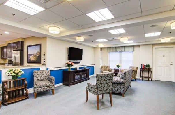 Inviting common area with comfortable seating and a television.