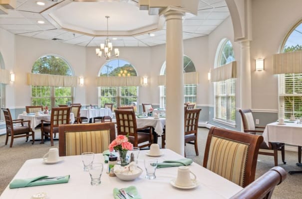 Dining room with tables set for residents