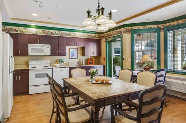 Dining area with a table and kitchen appliances