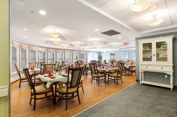 spacious dining room with tables and chairs