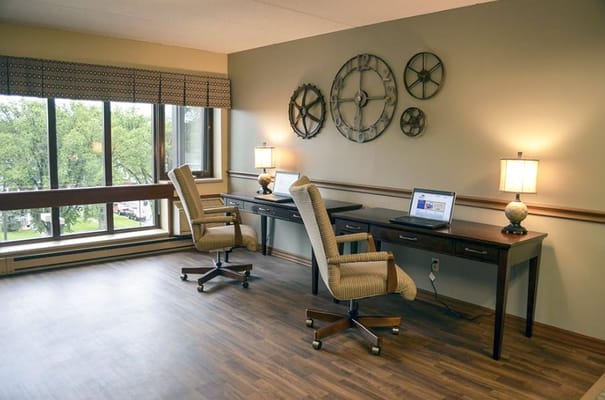 Interior space with desks and chairs in a common area