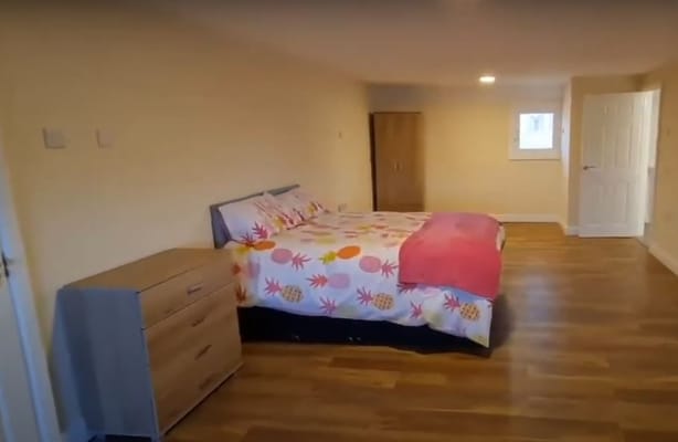 A bright resident room with a bed and furniture