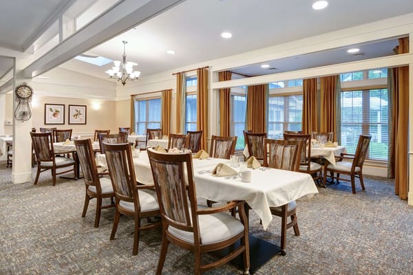 Dining area with tables set for residents