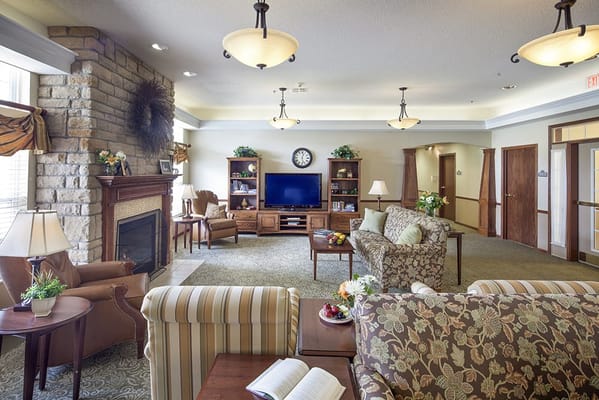Cozy common area with seating and a fireplace