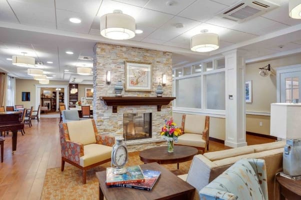 Cozy living room with seating and a fireplace