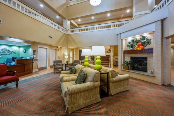 Bright and inviting lobby with seating and a reception desk
