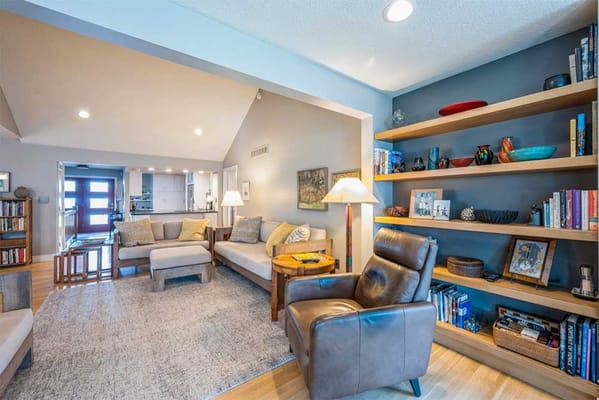 Cozy living room with seating and bookshelves