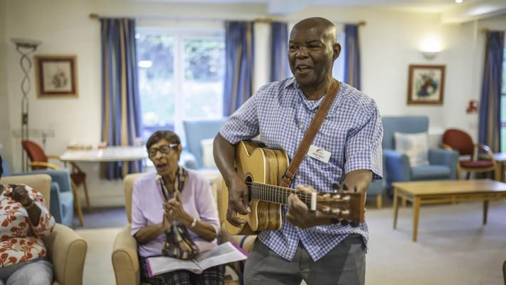 Residents enjoying a lively musical activity in a common area