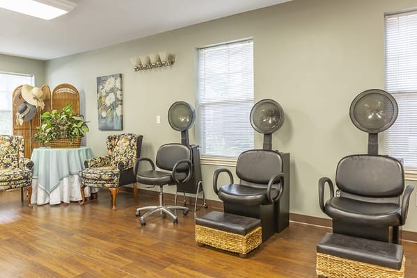 Salon area with hair styling chairs and decorative elements