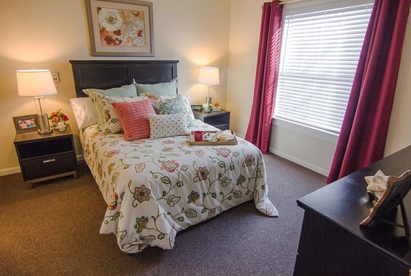 A cozy resident room with stylish decor and natural light