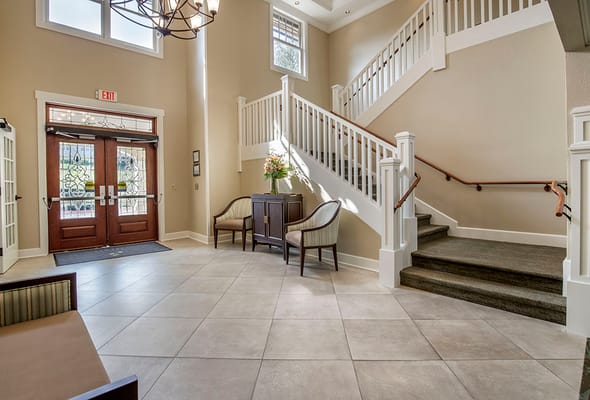 Bright lobby area with staircase and seating