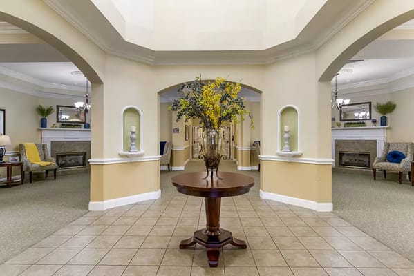 Interior view of a lobby with flower arrangement