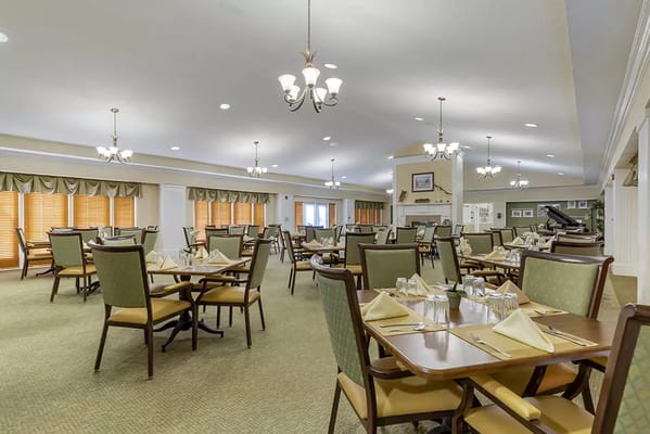 Dining room setup with tables and chairs
