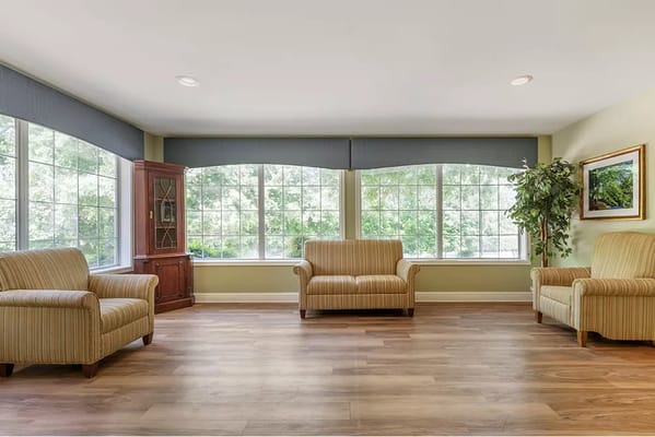 Cozy common area with comfortable seating and large windows