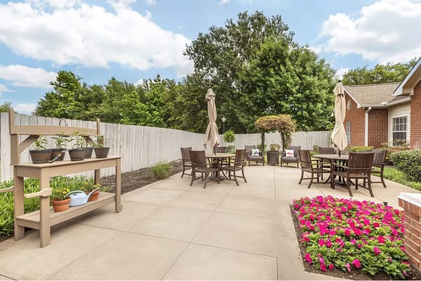 Outdoor seating area with flowers and plants