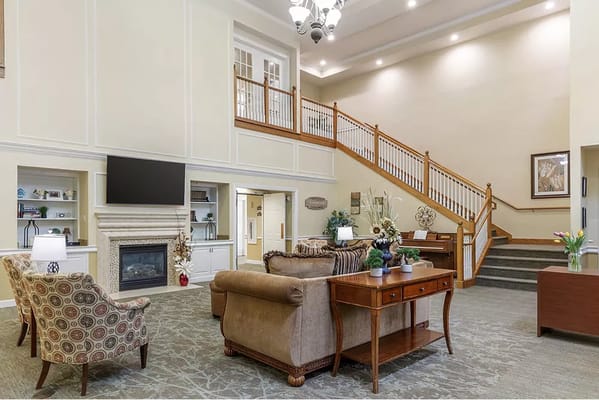 Bright lobby area with seating and staircase