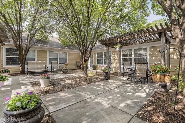 Outdoor patio with seating and garden plants