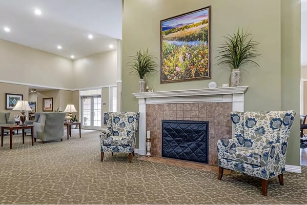 Cozy common area with comfortable seating and a fireplace