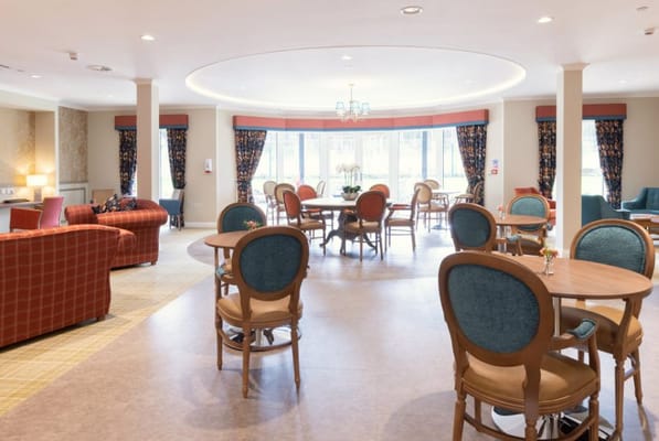 Bright common area with seating and tables