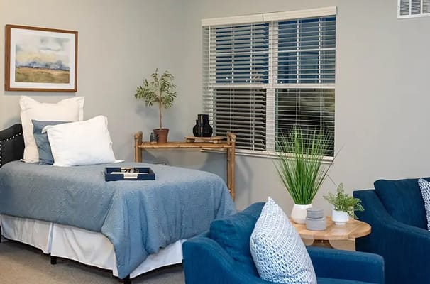 Cozy private room with comfortable furnishings and natural light