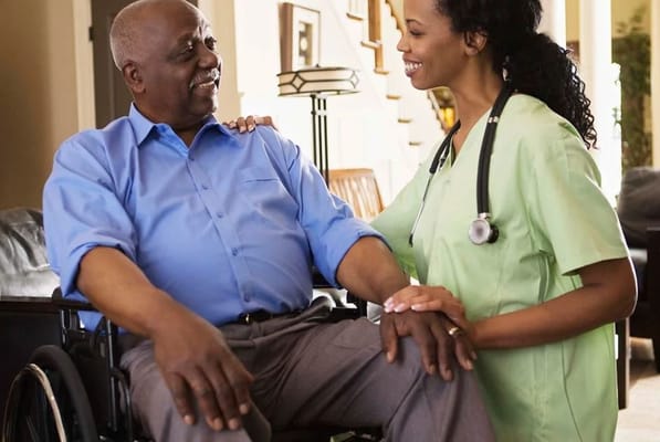 Caregiver interacting with a resident indoors