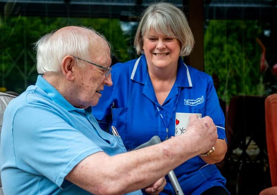 Staff member interacting with a resident