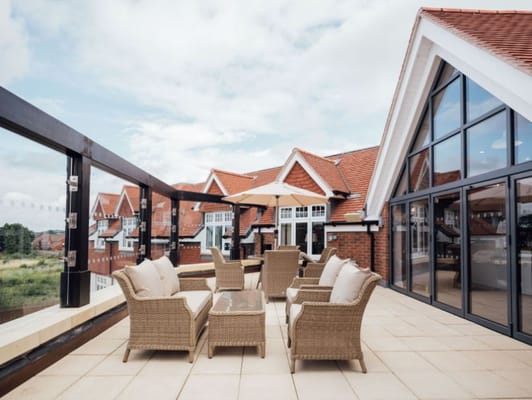 Outdoor seating area with a view of the facility