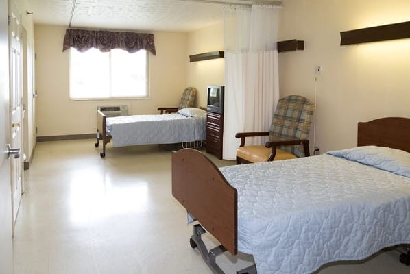 Interior view of a shared resident room with two beds