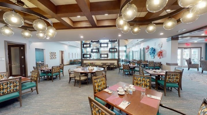 Elegant dining room with tables set for meals