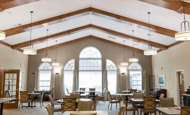 Interior view of a spacious dining room with tall ceiling