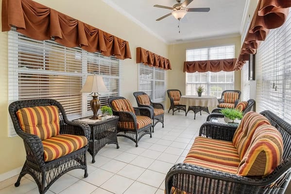 Interior common area with wicker furniture and natural light