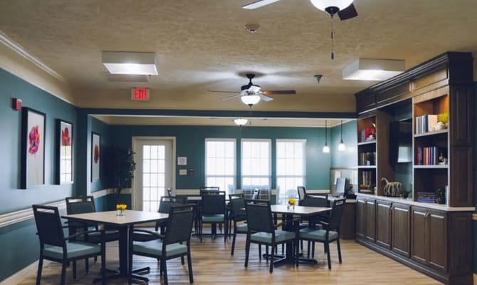 Bright and welcoming common area with dining tables