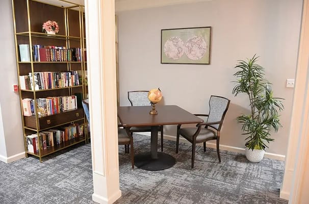 Cozy reading area with bookshelves and a globe