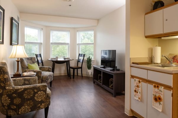 Cozy private resident room with kitchenette and seating area
