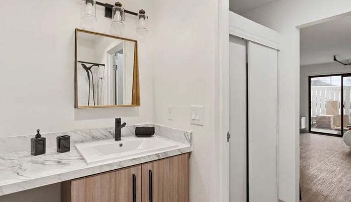 A bright bathroom with modern fixtures and decor