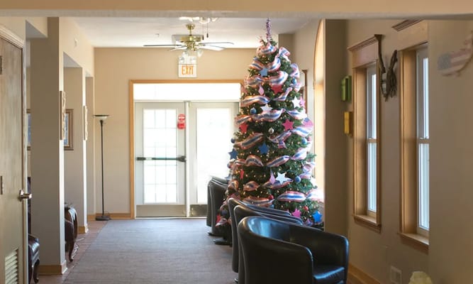 Interior corridor decorated for Christmas with a tree
