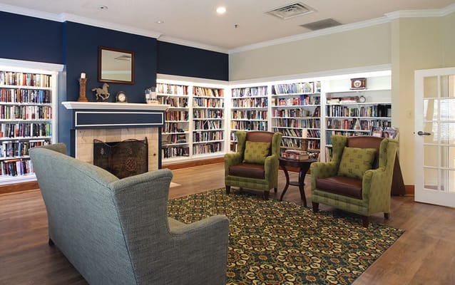 Cozy library area with bookshelves and seating
