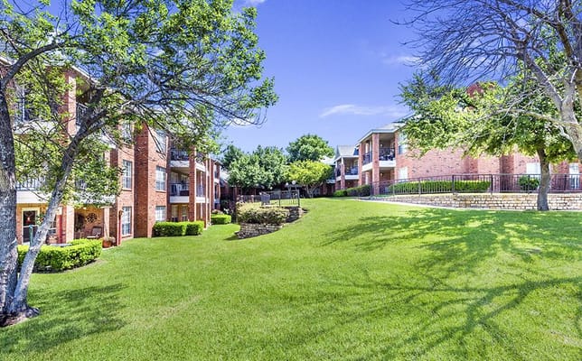 Outdoor view of building exteriors and green lawn