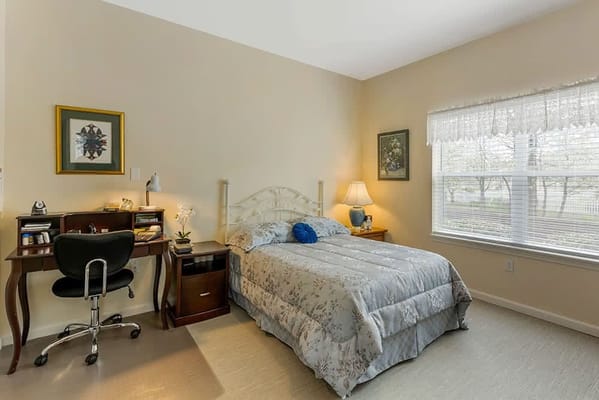 Cozy resident room with bed and desk