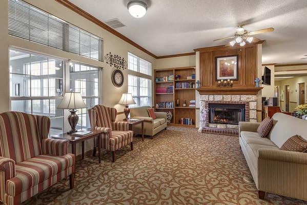 Comfortable common area with seating and a fireplace