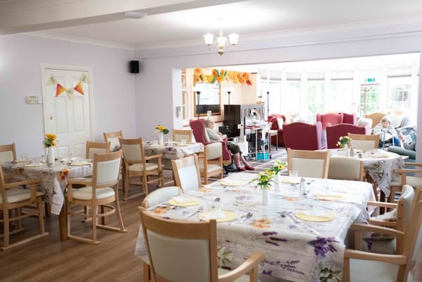 Bright dining area with flower centerpieces